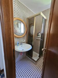 a bathroom with a sink and a mirror at Casa Il Panorama in Praiano +56 photos