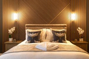 a bedroom with a bed with towels on it at The Dragon in Willington