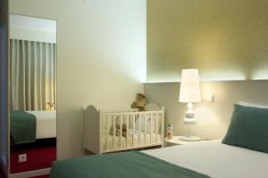 Postel nebo postele na pokoji v ubytování Hotel Lagoa dos Pastorinhos