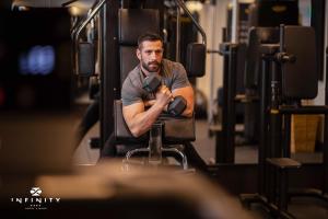 a man sitting in a chair on a bus at Infinity Hotel & More in Budva