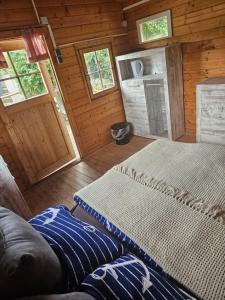 a room with two beds and a couch in a cabin at Yachthafen Karner Bootsverleih in Mukrena +7 photos