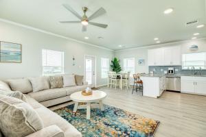a living room with a couch and a table and a kitchen at Paradise Found - Great Location - Family Friendly in Surfside Beach