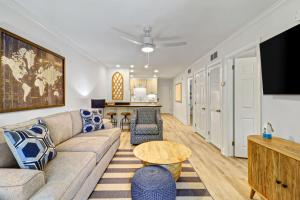 a living room with a couch and a table at Coastal Retreat Villa on Port Royal Sound in Hilton Head Island +60 photos