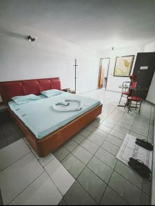 Postel nebo postele na pokoji v ubytování Onix Motel