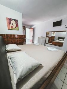 Postel nebo postele na pokoji v ubytování Onix Motel