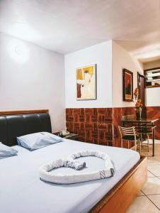 Postel nebo postele na pokoji v ubytování Onix Motel