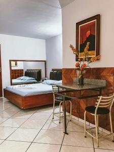 Postel nebo postele na pokoji v ubytování Onix Motel