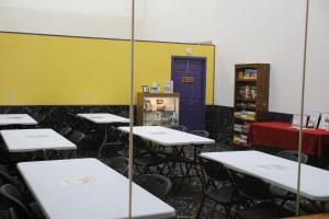a classroom with tables and chairs and a purple door at Dells Vacations At Tamarack Resort in Wisconsin Dells
