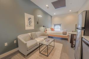 a living room with a couch and a bed at Serene Studio Close to MGH in Boston