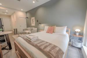 a bedroom with a large white bed in a room at Serene Studio Close to MGH in Boston