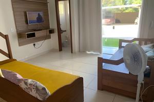 TV a/nebo společenská místnost v ubytování Brasil Coroa e Villa dos Corais