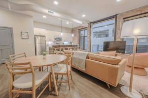 a living room with a couch and a table at Elegant 2 Bedroom Prime Location in Boston