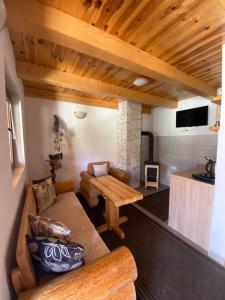 a living room with a couch and a table at Bungalows Ivan in Žabljak