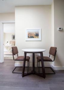 a table and chairs in a living room at Downtown Boston Nurses Welcome in Boston