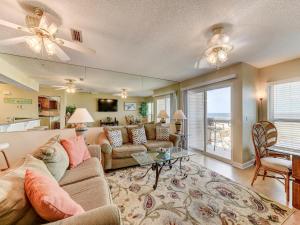 a living room with a couch and a table at Surfside Six E Unit 5 in Saint Augustine
