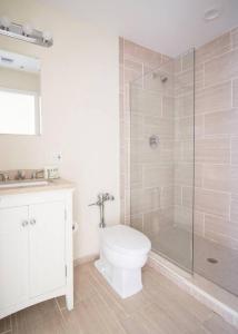 a bathroom with a toilet and a glass shower at Studio walking distance to MGH and Tufts Medical in Boston