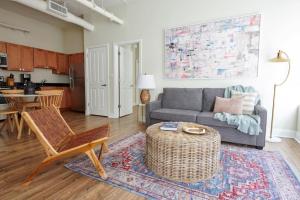a living room with a couch and a table at Wonderful FIDI 2br with Keyless Entry in Boston