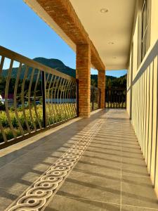 a walkway on a house with a view of the ocean at Valle de Cerocahui Hotel in Cerocahui