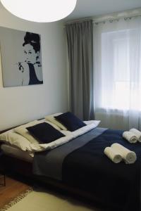 Postel nebo postele na pokoji v ubytování Cherry Apartment + 13 fotografií