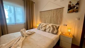 a bedroom with a bed and a window at Cozy Historical Andalusian 3BR House Peachy Stays in Mijas