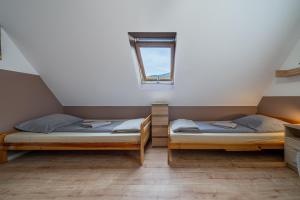 Posteľ alebo postele v izbe v ubytovaní Pokoje gościnne Tessa
