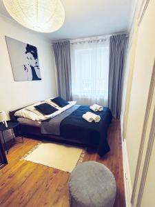 Postel nebo postele na pokoji v ubytování Cherry Apartment