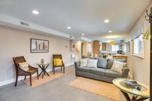 a living room with a couch and a table at 9 Mi to Dtwn Quiet South Denver Apartment in Denver