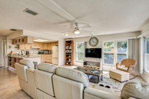 a living room with a couch and a table at Outdoor Oasis Canal-Front Home in Crystal River in Crystal River