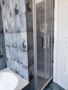 a bathroom with a shower and a sink at CASA DORI in Cisternino +24 photos