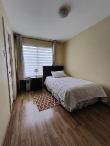 Hostal Casa Arrayán客房内的一张或多张床位