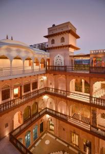 a large building with balconies on the side of it at Haveli Dharampura - UNESCO awarded Boutique Heritage Hotel in New Delhi