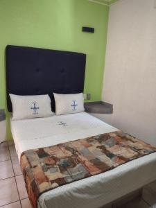 Postel nebo postele na pokoji v ubytování Hotel Astur