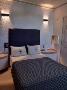 Postel nebo postele na pokoji v ubytování Hotel Astur
