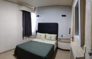 Postel nebo postele na pokoji v ubytování Hotel Astur