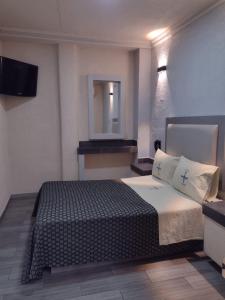Postel nebo postele na pokoji v ubytování Hotel Astur