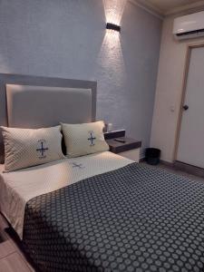 Postel nebo postele na pokoji v ubytování Hotel Astur