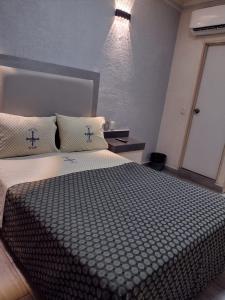 Postel nebo postele na pokoji v ubytování Hotel Astur