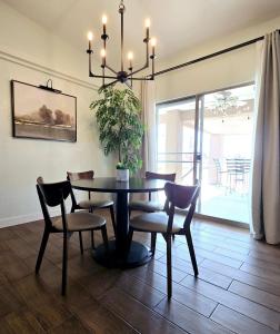 a dining room with a table and chairs and a chandelier at The Fieldhouse in Blythe