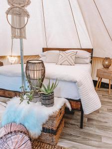 two beds in a room with a tent at Haleiwa Off Grid Tent - 5 min from town in Haleiwa