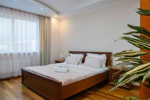 Postel nebo postele na pokoji v ubytování Alatau Grand View Suites by MEGA