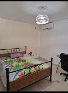 Postel nebo postele na pokoji v ubytování Ti'Eva appartement F3 avec piscine partagée