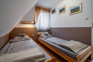 Posteľ alebo postele v izbe v ubytovaní Pokoje gościnne Tessa