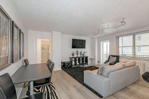 a living room with a couch and a table at Downtown Condo Walk to GWCC and Coca-Cola in Atlanta +25 photos