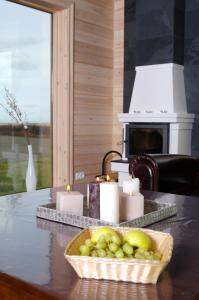 a basket of fruit on a counter with candles at Fishing Lodge Hálsakot in Sleðbrjótur