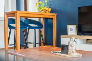 a table with a glass bottle on top of a table at Apartman Lorena in Fažana