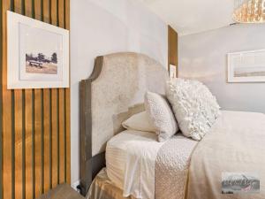 a bedroom with a bed with white sheets and pillows at 2 spaces More Space with 2 units at same location PNW Retreat in Philomath