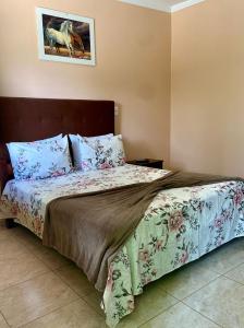 Cama o camas de una habitación en Pousada Cascata de Pedra