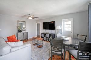 a living room with a couch and a table at Prime Downtown Atlanta Condo with Balcony in Atlanta