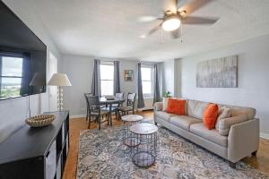 a living room with a couch and a table at Prime Downtown Atlanta Condo with Balcony in Atlanta