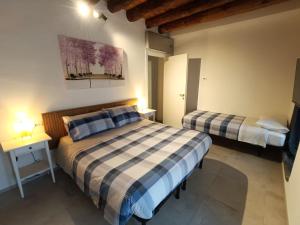 Postel nebo postele na pokoji v ubytování Angelo&Marì Mountain Lake Iseo Hospitality